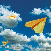 large_paper-airplane-cloudy-sky.png